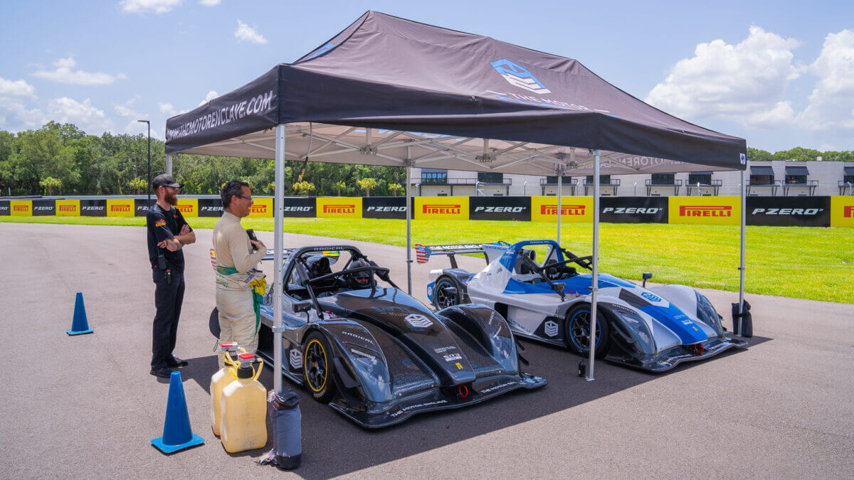 Radical race cars under canopy