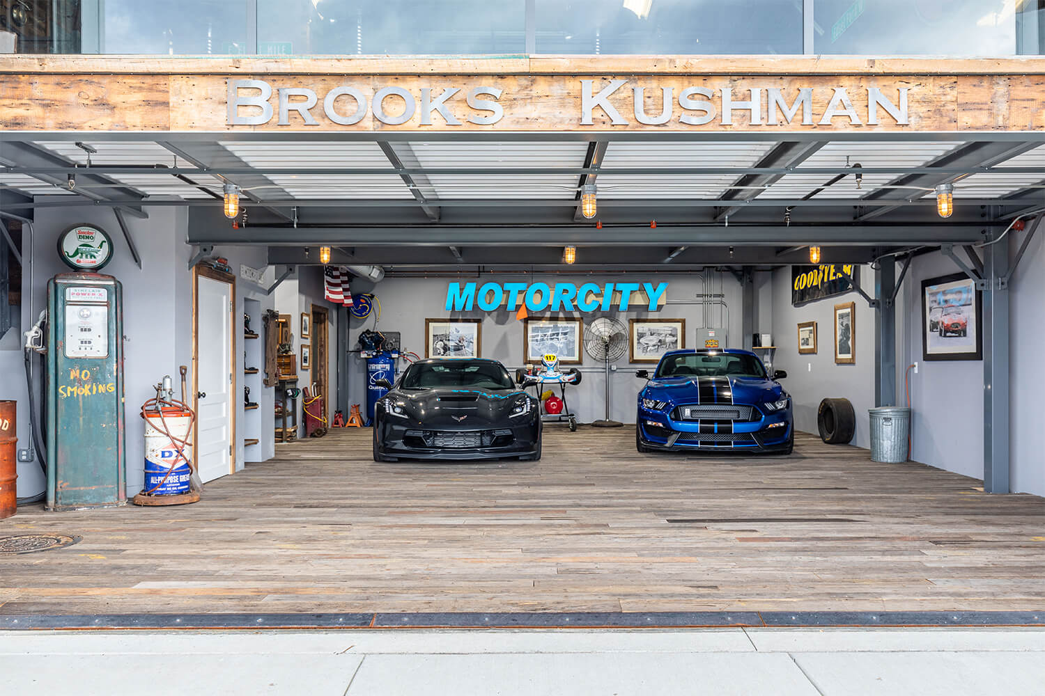cars in garage with motorcity sign