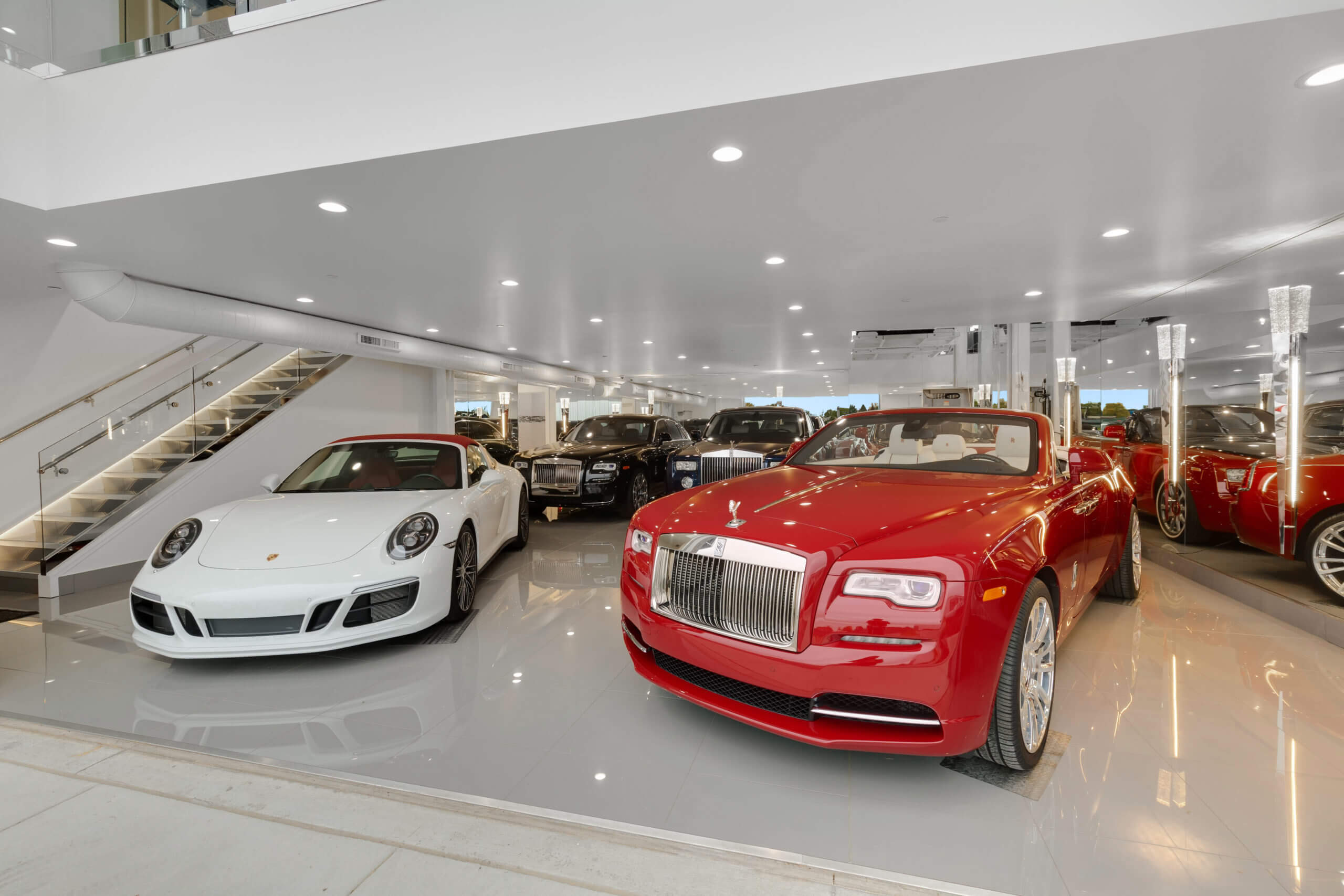 cars in white and red garage