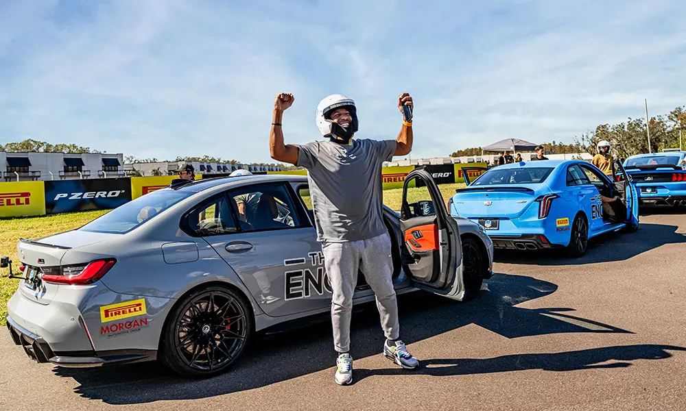 Person celebrating race car